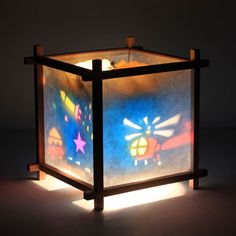 a lit up box sitting on top of a table