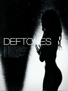 a woman standing in front of a dark background with the words deftones on it