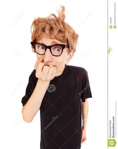 a young boy wearing glasses with his hand on his chin and looking at the camera