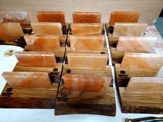 several different types of soaps on wooden trays