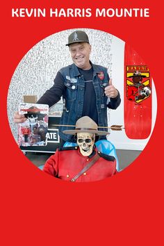 a man holding a skateboard next to a fake human head in front of a red background