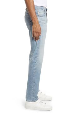 A well-worn wash puts a classic stamp on slim-cut jeans shaped from stretchy cotton denim. 33" inseam; 13" leg opening; 10 1/4" front rise; 15" back rise (size 32) Zip fly with button closure Five-pocket style 98% cotton, 2% polyurethane Machine wash, tumble dry Imported Men's Clothing Everyday Jeans With Frayed Straight Hem, Stretch Straight Cropped Jeans With Five Pockets, Stretch Cropped Denim Jeans With Straight Hem, Everyday Jeans With Frayed Hem, Classic Stretch Light Wash Jeans, Light Wash Stretch Straight Jeans, Slim Fit Jeans With Five Pockets For Spring, Straight Stretch Jeans In Light Wash, Fitted Washed Blue Jeans With Five Pockets