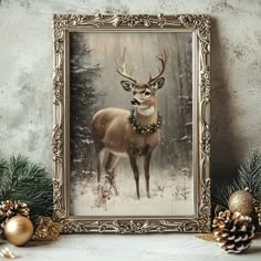 a painting of a deer in the snow surrounded by pine cones and christmas decorations on a table