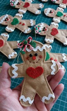 someone is holding up some gingerbread cookies