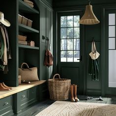 an entryway with green walls and wooden flooring, hanging baskets on the wall