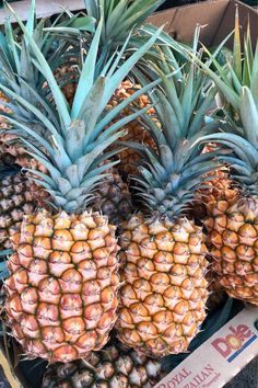 several pineapples are stacked on top of each other