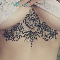 a woman's stomach with flowers on it