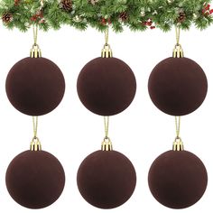 four brown christmas balls hanging from a tree