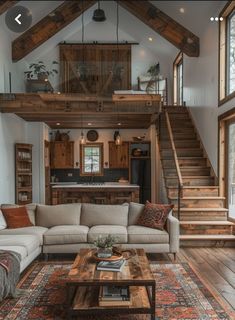 a living room filled with furniture and wooden stairs