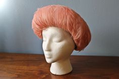 This Modern Miss halo style hat is from the 1950s-60s. In the shape of a halo, or a doughnut, this hat is decorated entirely with pink feathers. The lining is black, and likely made of cotton. * One Size Fits Most Heads Condition: In good to great vintage condition. Visible glue. Feathered Hat, Good To Great, Bowler Hat, Halo Style, Pink Feathers, Party Earrings, Beaded Drop Earrings, Pink Earrings, Red Wool