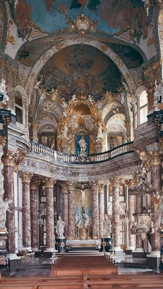 the interior of an old church with painted ceilings