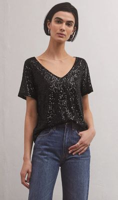 Looking for that wow factor? The fully lined v-neck Marbella Sequin Top has you covered. Able to be worn tucked or untucked, this relaxed, sparkly Stretch Satin Top will add dimension to your casual or elevated look, and we love it with denim. Relaxed fit True to size Stretch Sequin: 92% Polyester, 8% Spandex V necklin Girls Together, Shopping Event, Cropped Denim Jacket, Wow Factor, Trend Forecasting, Satin Top, Stretch Satin, Sequin Top, Cropped Denim