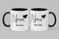 two black and white coffee mugs with the names nana and estr on them