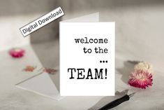 a greeting card with the words welcome to the team on it next to a flower