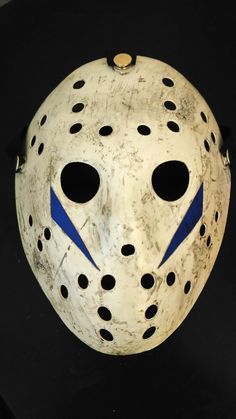 a mask with holes and blue lines on it