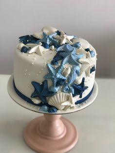 a white and blue cake with stars on it