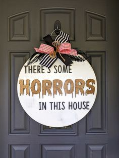 there's some horrors in this house door sign