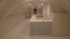 an empty room with many drawers and cabinets