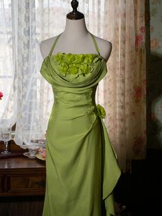 Step into a world of enchantment with this Vintage Green Halter Neck Floral Prom Gown. Designed to capture the essence of fairy-tale elegance, this gown features a lush green hue that evokes the tranquility of nature. The halter neck design beautifully accentuates your shoulders and neckline, offering a graceful and sophisticated look.  Adorned with exquisite floral decorations at the bodice, the dress brings a touch of romance and whimsy. The intricate flower embellishments add a layer of textu Fairy Like Dresses, Pastel Green Prom Dress, Chartreuse Dress, Floral Fairy, Prom Inspo, Vintage Party Dresses, Flower Embellishments, Floral Decorations, Magical Fairy