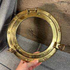 Vintage Solid Brass Porthole Frame | Marine and Maritime Portholes | Nautical Sailor Wall Hanging Collectibles | Sea and Ocean Coastal Decor Comes across old, but we don't know whether this is genuine vintage or was made in more recent times. Solid and quite heavy robust construction.  This is a solid brass frame only with no glass in between. Perhaps this would allow for it to be repurposed. Such as to use it as a DIY project so that to convert it into a wall hanging photo frame or to frame a p Hanging Photo Frame, Wall Hanging Photo Frames, Sea And Ocean, Brass Frame, Coastal Decor, Solid Brass, Photo Frame, Nautical, Patina