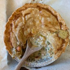 a pie with a wooden spoon in it