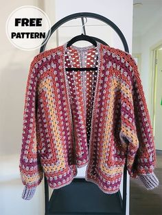 a crocheted jacket hanging on a rack with the text free pattern above it