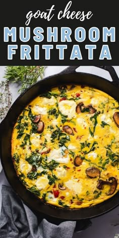 an omelet with mushrooms and spinach in a cast iron skillet on a table