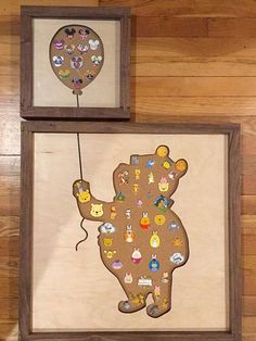 two framed pictures with cartoon characters on them, one has a balloon attached to it