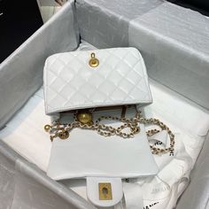 Description   CC Mini Flap Bag With CC Ball On Strap White For Women, Women’s Handbags, Shoulder And Crossbody Bags 6.7in/17cm AS1786  Rep 1:1  Measurements: 17 x 7 x 12 cm / 6.7 x 2.7 x 4.7 inches (Length x Width x Height)  White  Gold-toned hardware  Adjustable chain shoulder strap  Beautifully structured flap-over design  Inside zipped pocket  Includes box, dust bag.  This product is of the best quality. Chanel Mini Flap Bag, Baby Tote Bag, Louis Vuitton Shirt, Chanel Mini, Stylish Handbags, Chanel Bags, Evening Clutch Bag, Chanel Handbags, Tote Backpack