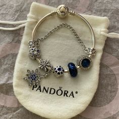 Brand New Nwt Authentic Pandora Sterling Silver Loving Heart White Enamel Bangle Bracelet With Crystal Star Moon Snowflake Galaxy Heart Blue Theme Charms Jewelry Bracelet Is Authentic Pandora In Great Condition. Sterling Silver 925. Discontinue Hard To Find Charms Are Non Brand Charms That I Placed On The Bracelet For You. They Are All Brand New. Please Review All Photos. You’ll Get Everything In Photos. Very Pretty Bracelet Set. Come With Pandora Dust Bag As Shown. Fashion Forever Love Beads Ch Pandora Theme Bracelet, Pandora Celestial Bracelet, Full Pandora Charm Bracelet, Silver Pandora Bracelet Ideas, Pandora Bracelet On Wrist, Pandora Bracelet Blue Theme, Pandora Summer Bracelet, Blue Pandora Charms, Gold And Silver Pandora Bracelet