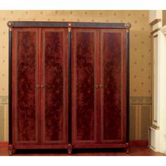 an ornately decorated armoire in a room