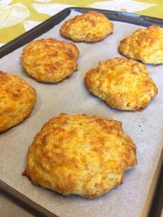 six biscuits on a baking sheet ready to be baked