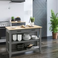 a kitchen island with plates and utensils on it in front of an oven