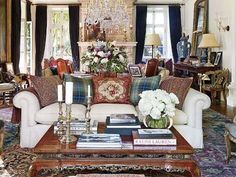 a living room filled with furniture and a chandelier