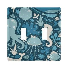 a light switch cover with an octopus and whale design