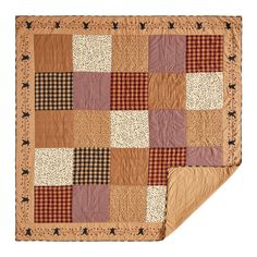 a brown and black patchwork quilt on a white background