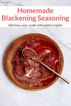 homemade blackening seasoning in a wooden bowl with a spoon on the side and text overlay reading homemade blackening seasoning delicious, easy, made with pantry staples