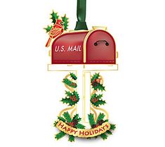 a red mailbox with the words u s mail and holly wreaths on it