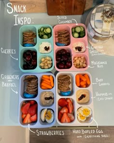 an organized lunch box filled with snacks and crackers on a counter top, labeled in the words snack inspo