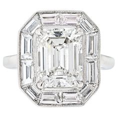 an emerald cut diamond ring with baguetts