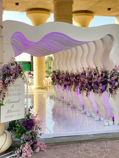 the flowers are arranged in vases on the stage for an event or ceremony to be attended