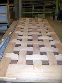 the table is made out of plywood and has many different patterns on it's surface