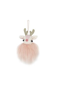 a pink and white reindeer ornament hanging from a string