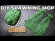 some green yarn and corks on a metal surface with the words diy spawning mop