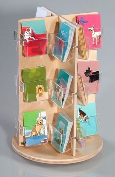 a wooden display with many cards on it