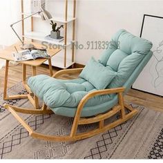 a rocking chair with blue cushions in a living room