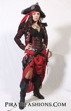 a woman dressed in pirate costume posing for the camera with her hands on her hips