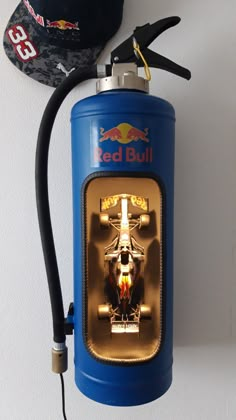 a red bull gas can is attached to the wall