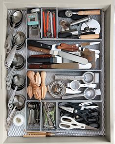 a drawer filled with lots of kitchen utensils