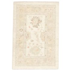 a white rug with an ornate design on it